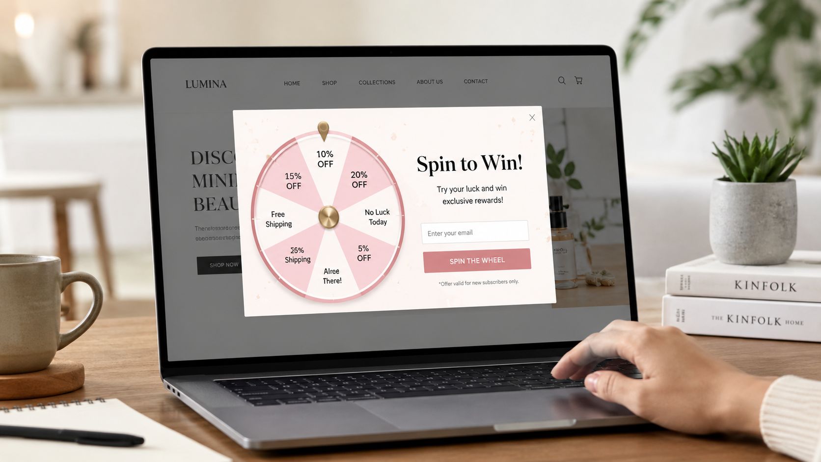 A laptop on a wooden desk displaying a Spin to Win promotional popup on a website.